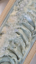 Load image into Gallery viewer, Oceania freshly poured wet soap in the wood mold.  Persian Blue Salt is sprinkled on the textured top